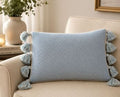 Cojin Textura Con Pompones Grandes Laterales Celeste